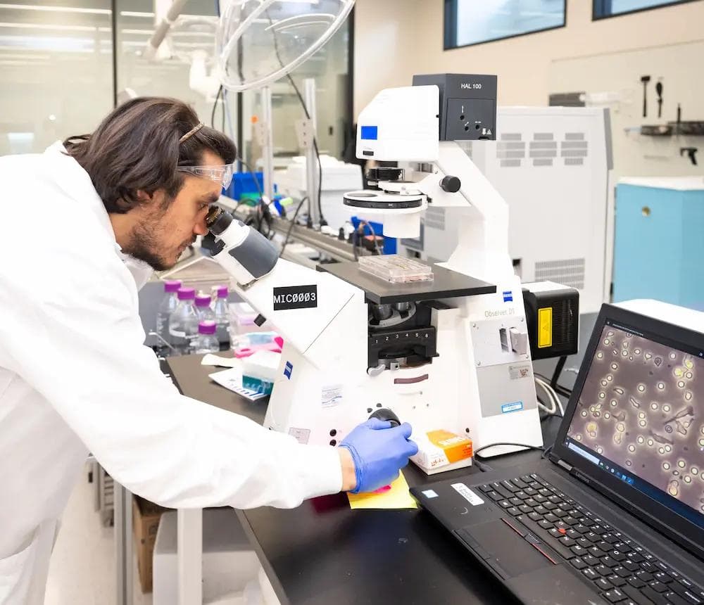 Scientist with microscope